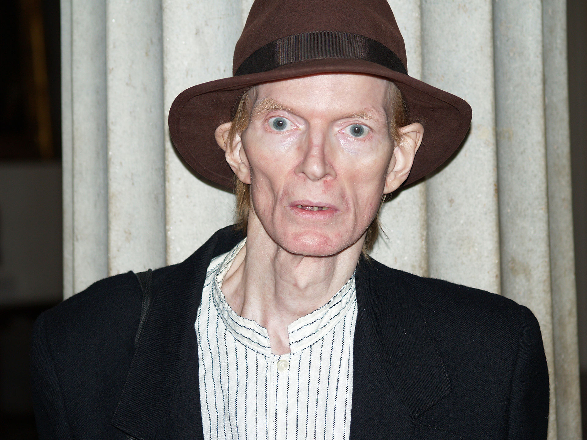 Imagem de referência relacionada a Jim Carroll, item descrito como escritor, poeta e músico punk estadunidense