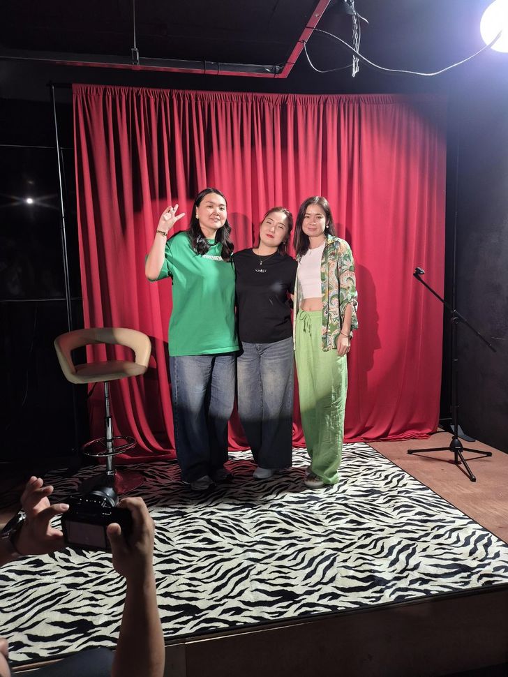 Veronika Kim, left, and Lyazzat Khan, right, pose with a fan. Courtesy of Event Max